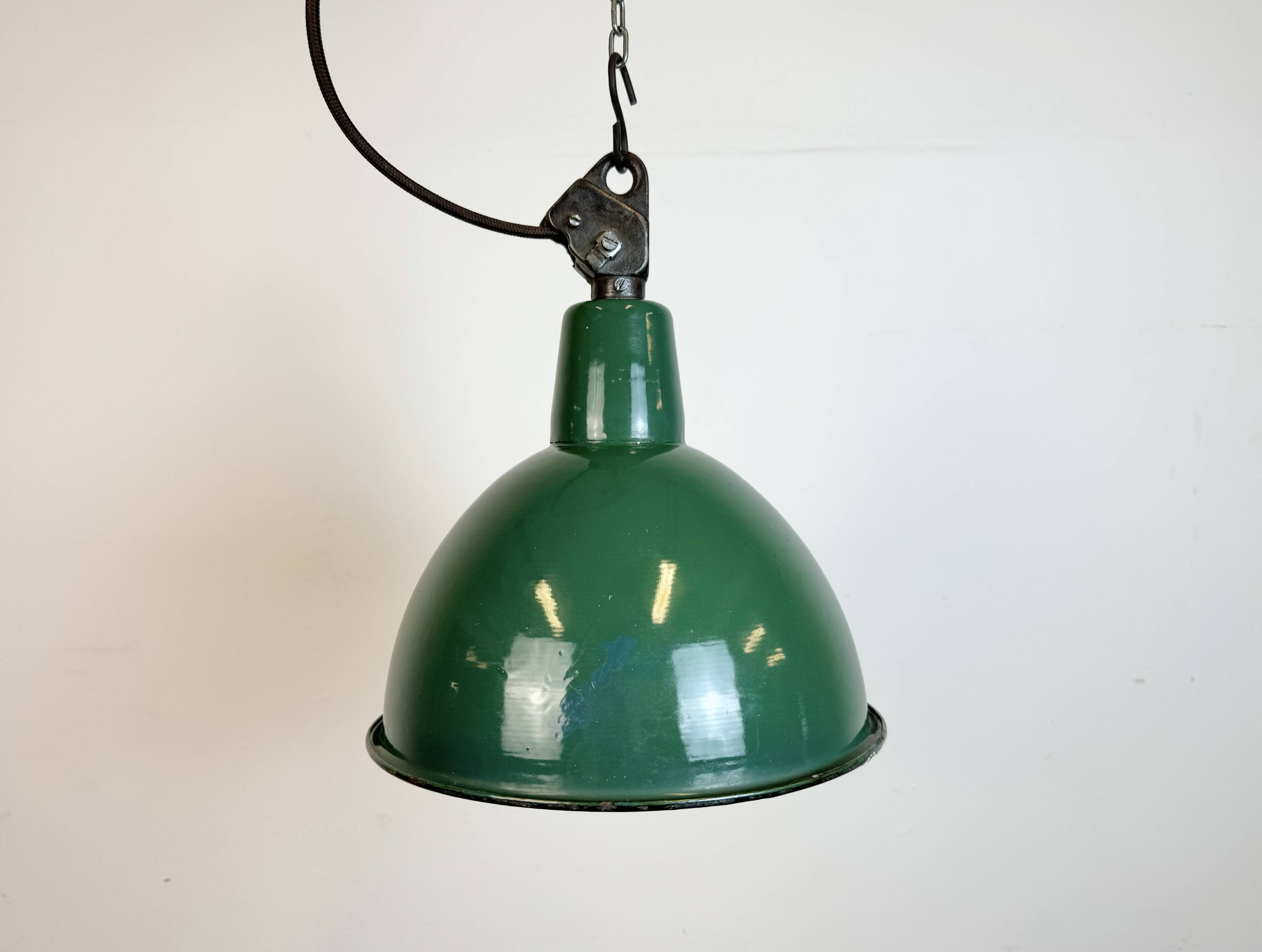 Industrial green enamel factory lamp with cast iron top, 1960s