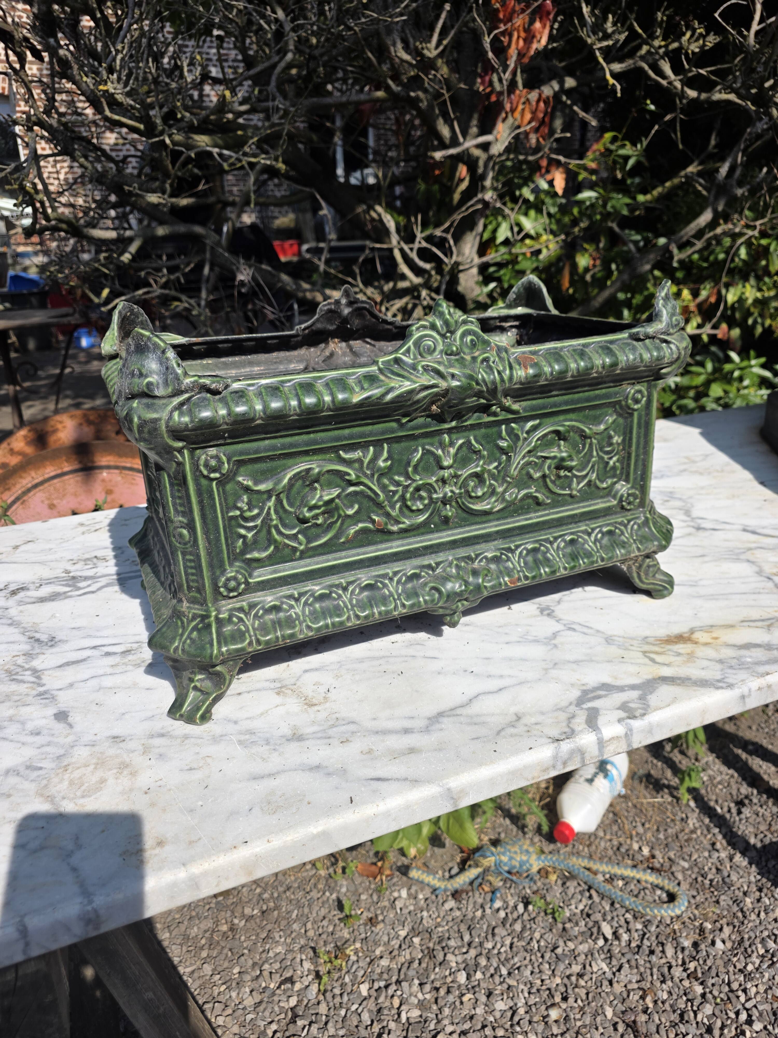 Antique enamelled cast iron planter in the Napoleon III style.
