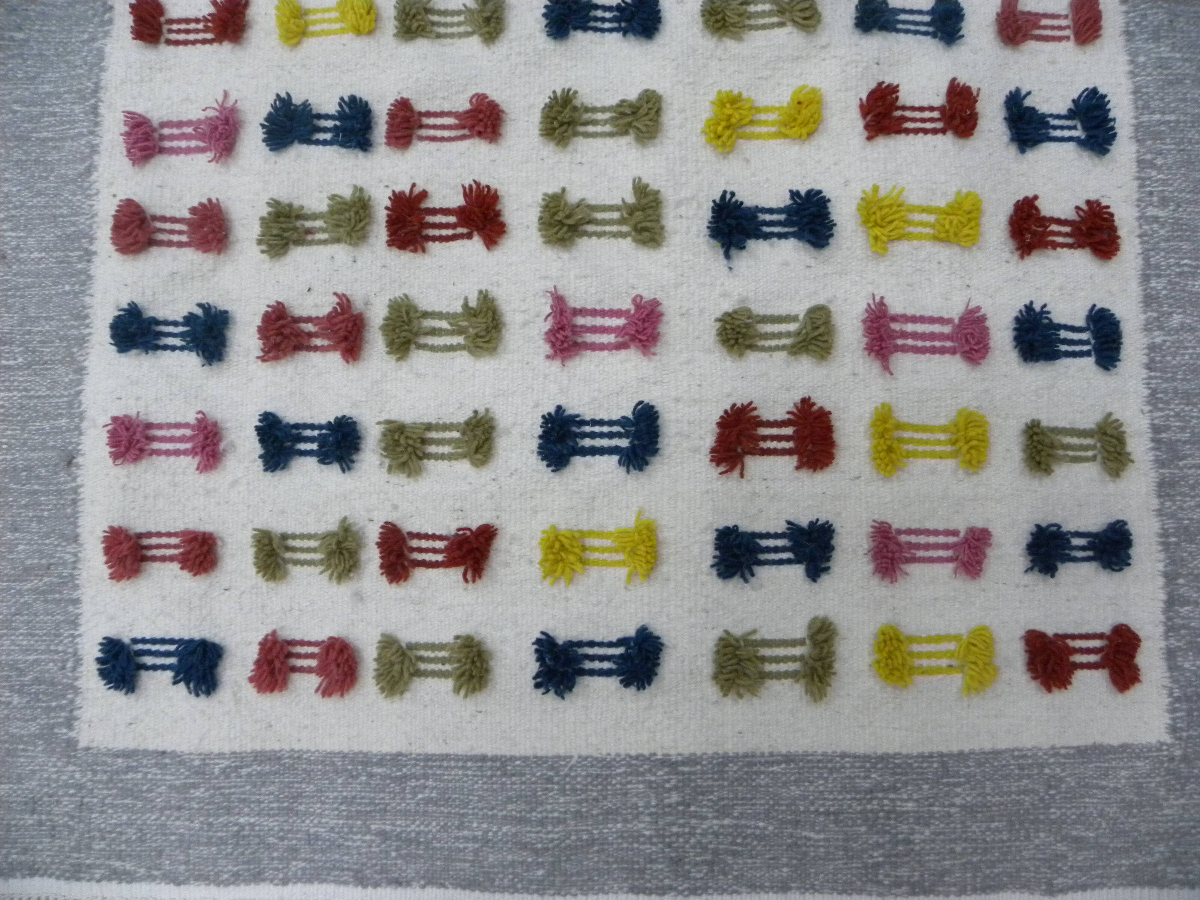 Handwoven Modern Boho Wool Rug with Colourful Patterns and Pompoms