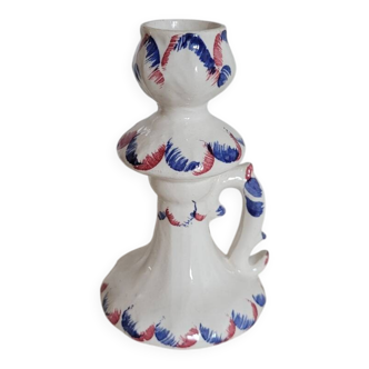 Ceramic candlestick with red and blue decoration.