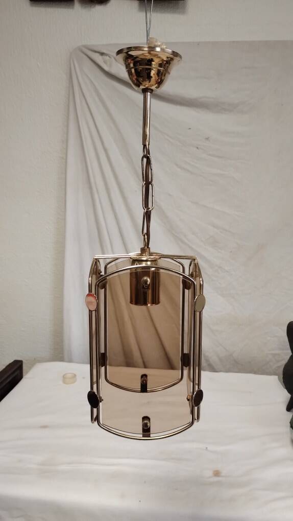 Suspension in gold metal and smoked glass