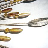 Round sun mirror with pearl rays and leaves