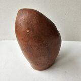 Terracotta face sculpture in African art style