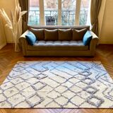 Berber cream carpet with blue patterns