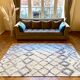 Berber cream carpet with blue patterns