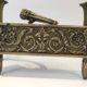 Pair of Empire Period Chenets in Chiselled Bronze with Torches and Leaf Frieze