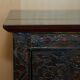 Antique polychrome Tibetan altar cabinet with deer and flowers.