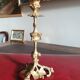19th-century gilded bronze candlestick with leaf motifs, height 23.5 cm.