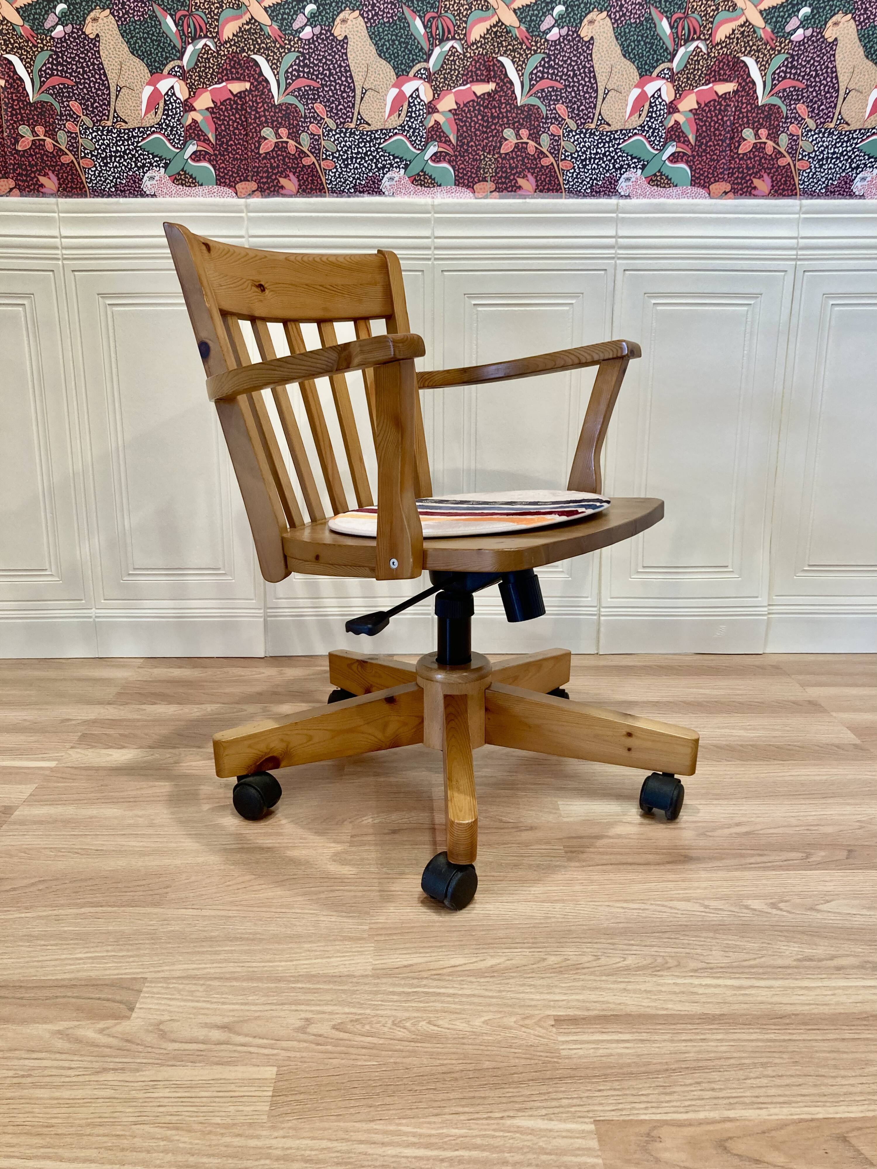 Solid wood swivel and reclining armchair.