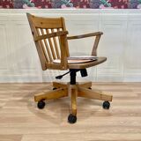 Solid wood swivel and reclining armchair.