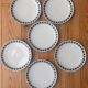 Vintage Thomas Germany flat plates, geometric blue rosette design.