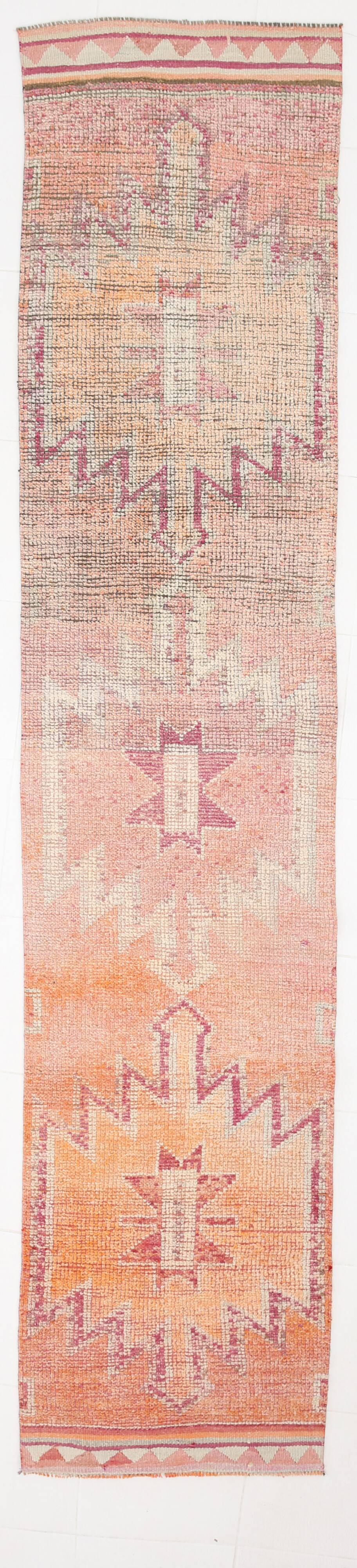 2x12 shades of pale orange vintage runner rug