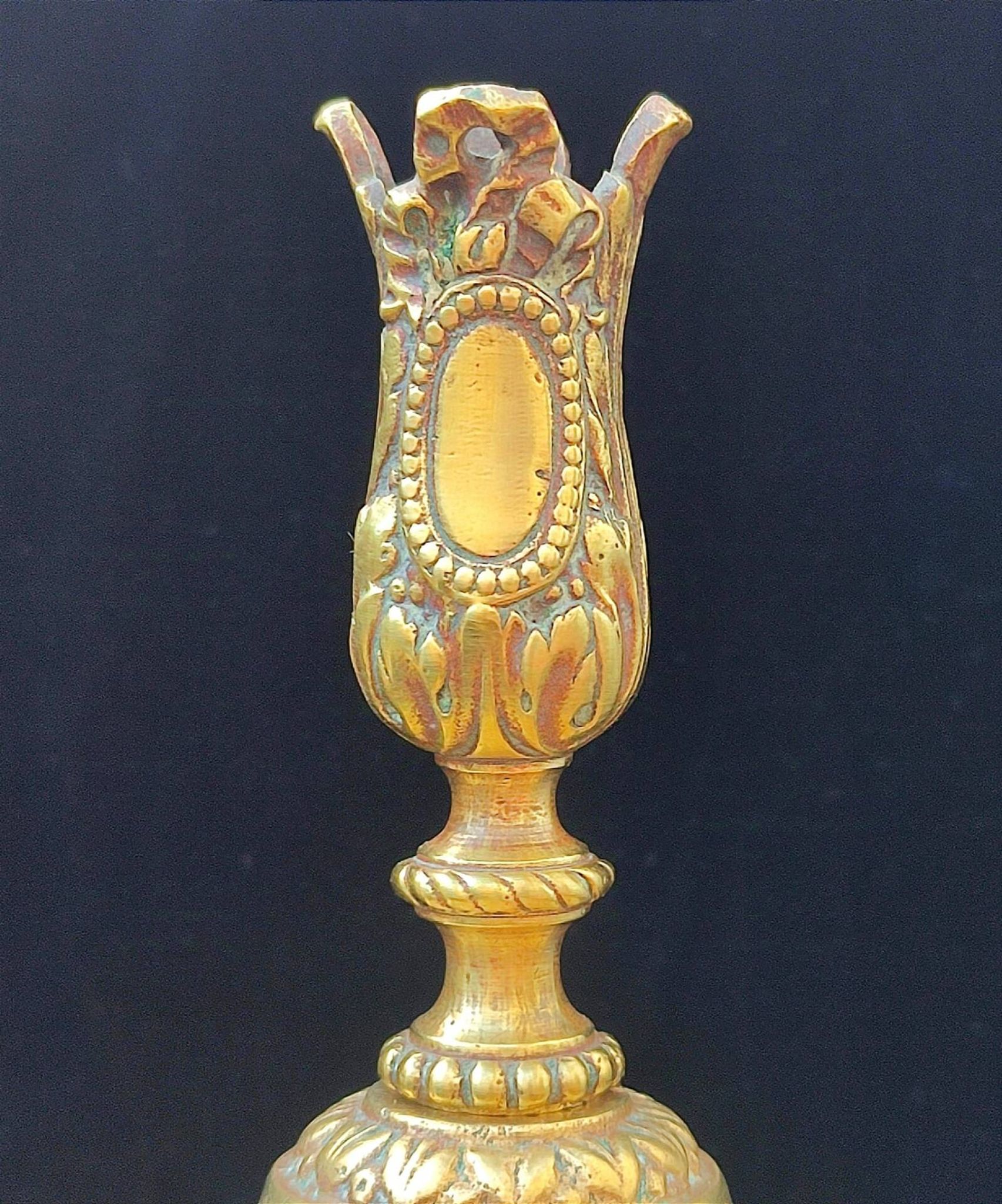 Pair of antique carved bronze candlesticks.