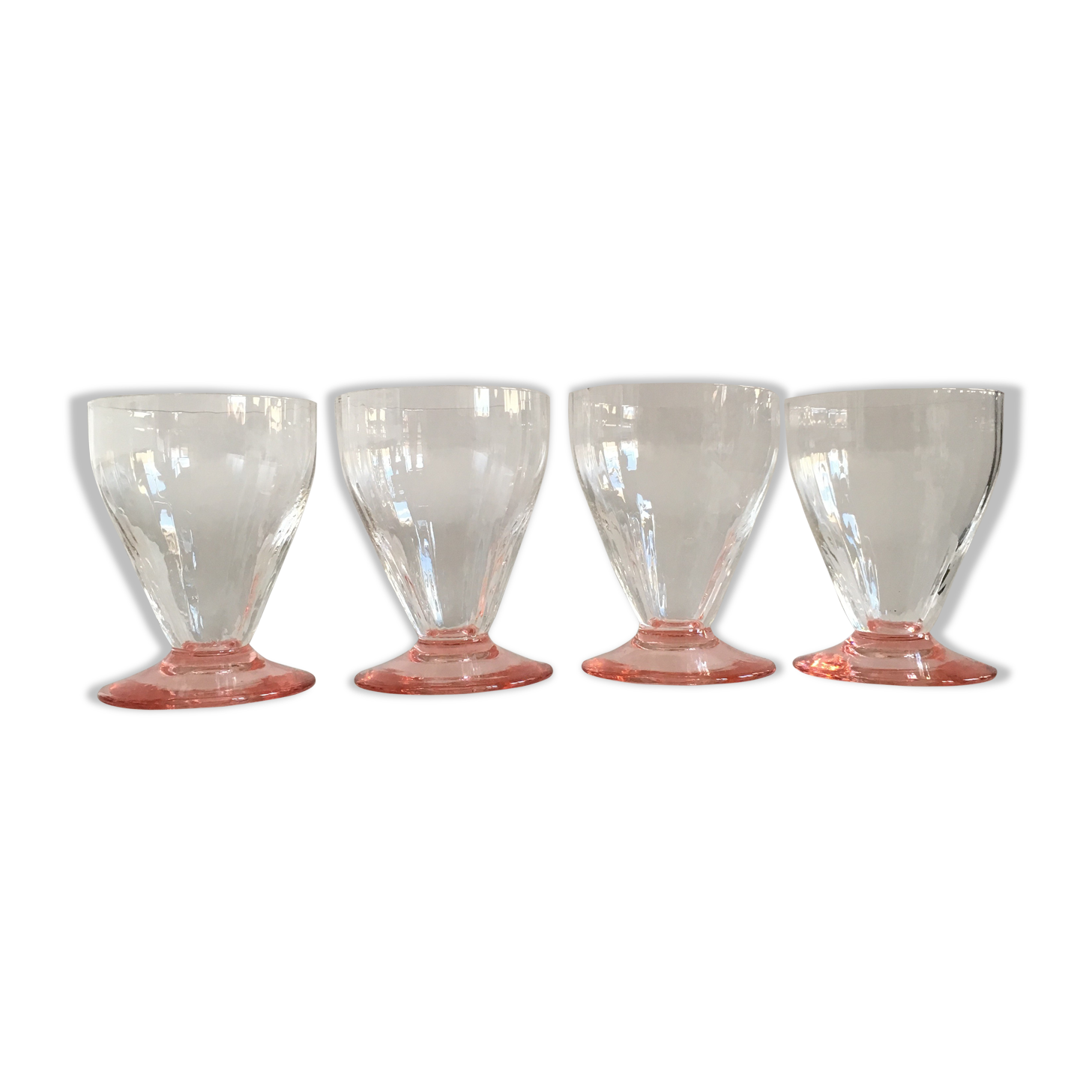 Lot of water in white and pink glass glasses