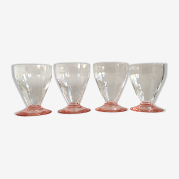 Lot of water in white and pink glass glasses