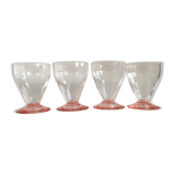 Lot of water in white and pink glass glasses