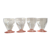 Lot of water in white and pink glass glasses
