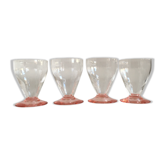 Lot of water in white and pink glass glasses