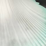 Frosted glass flower pendant with a water green edge.