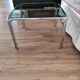 Table basse piètement chromé et plateau en verre fumé noir