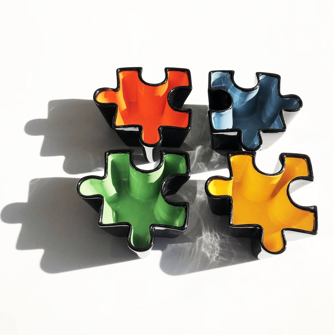 Set of ceramic puzzle pocket trays. Italy, 1980s.
