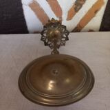 Old candlestick with chiseled bronze collar