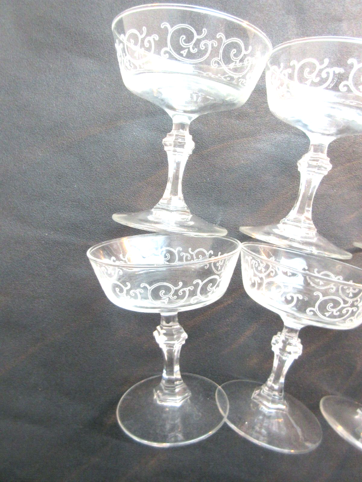 6 Louis XV style champagne glasses engraved with arabesques, baluster foot