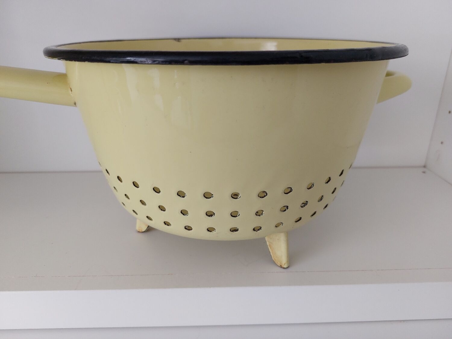 Vintage yellow enamelled strainer