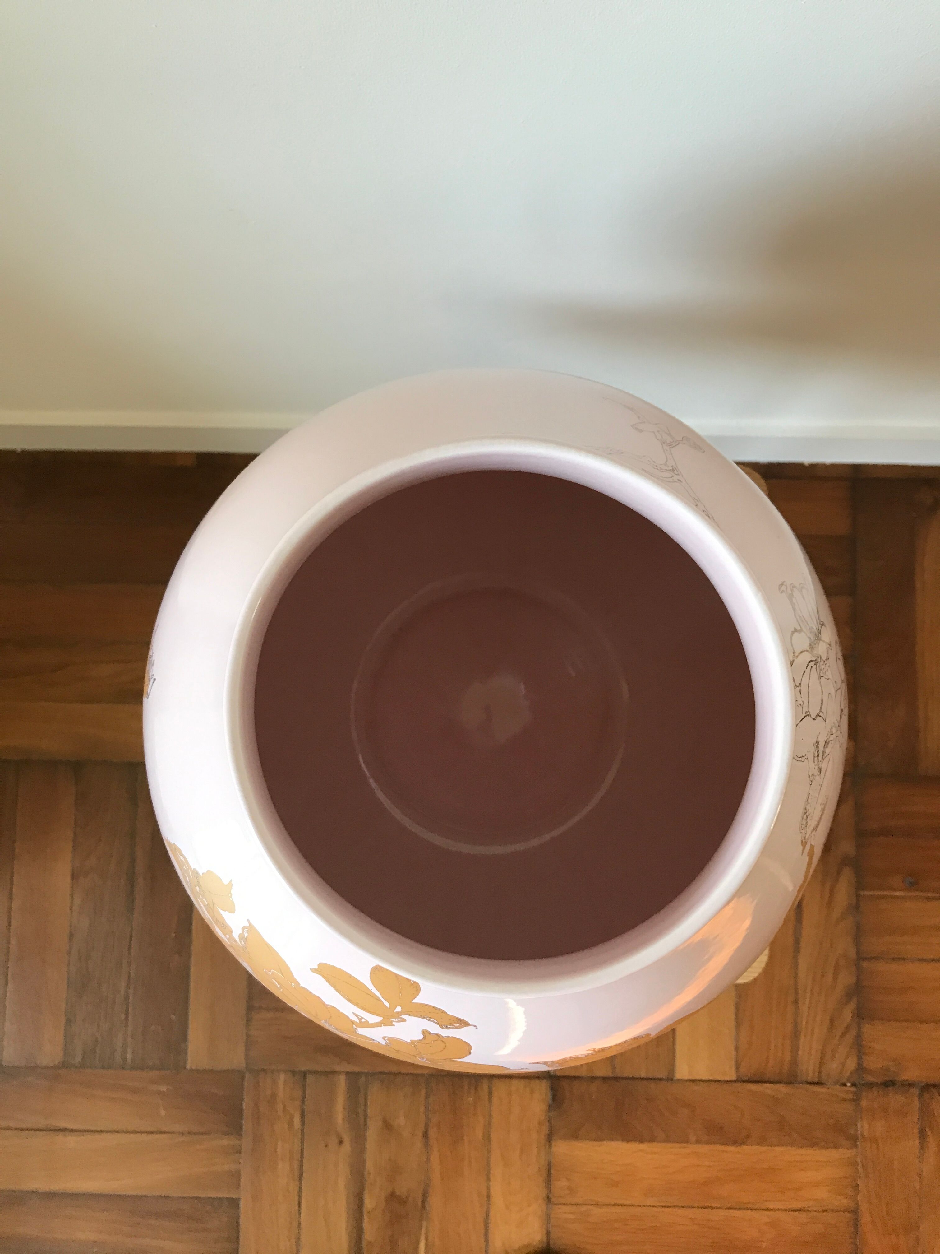 Pale pink and golden earthenware vase