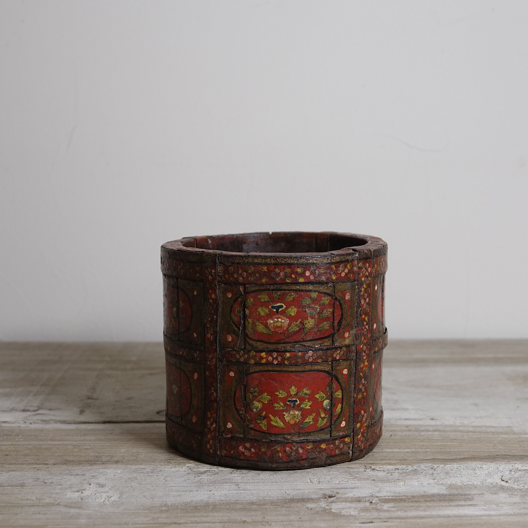 Antique wooden pot painted by hand