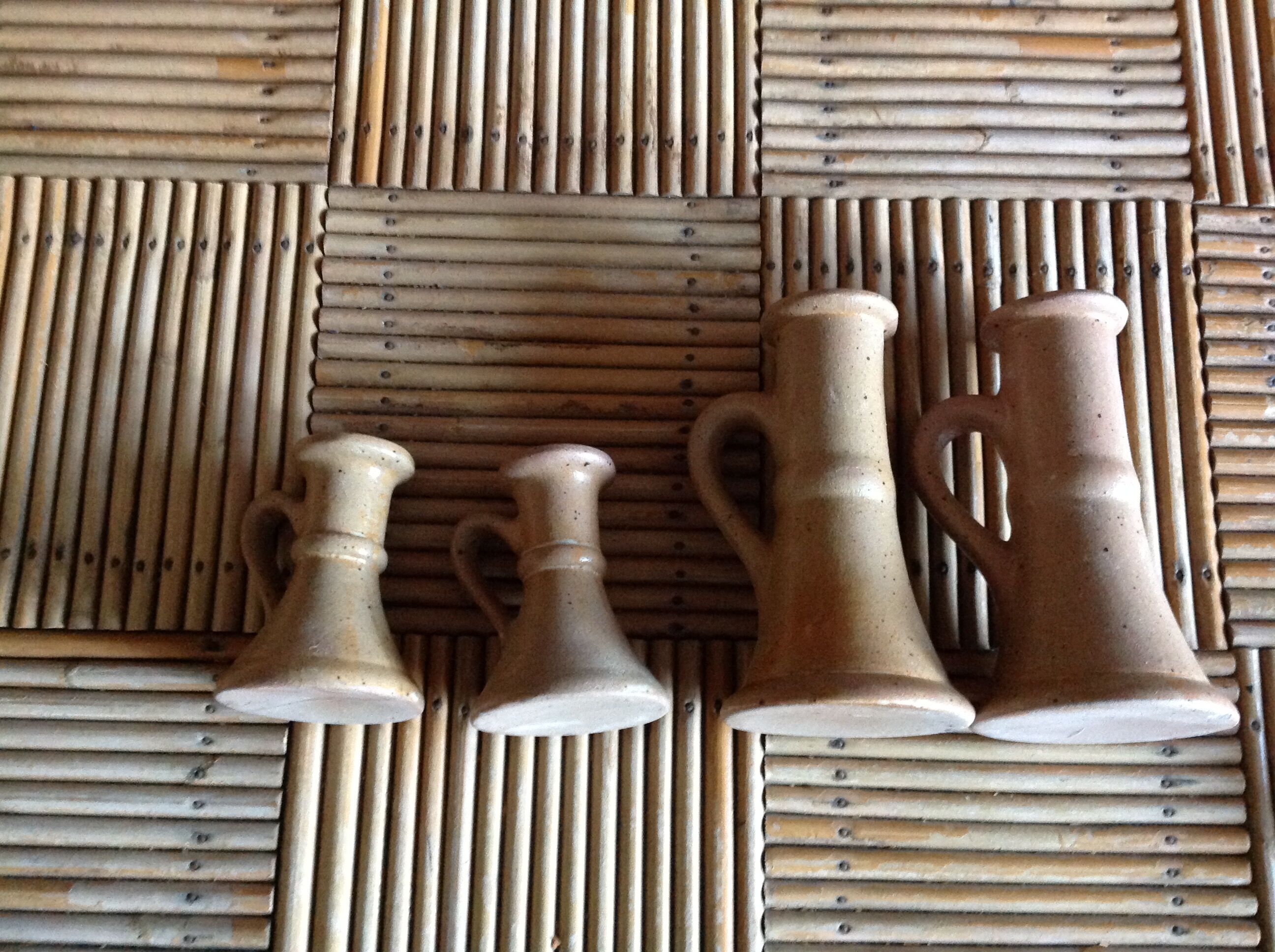 Set of 4 candlesticks in sandstone