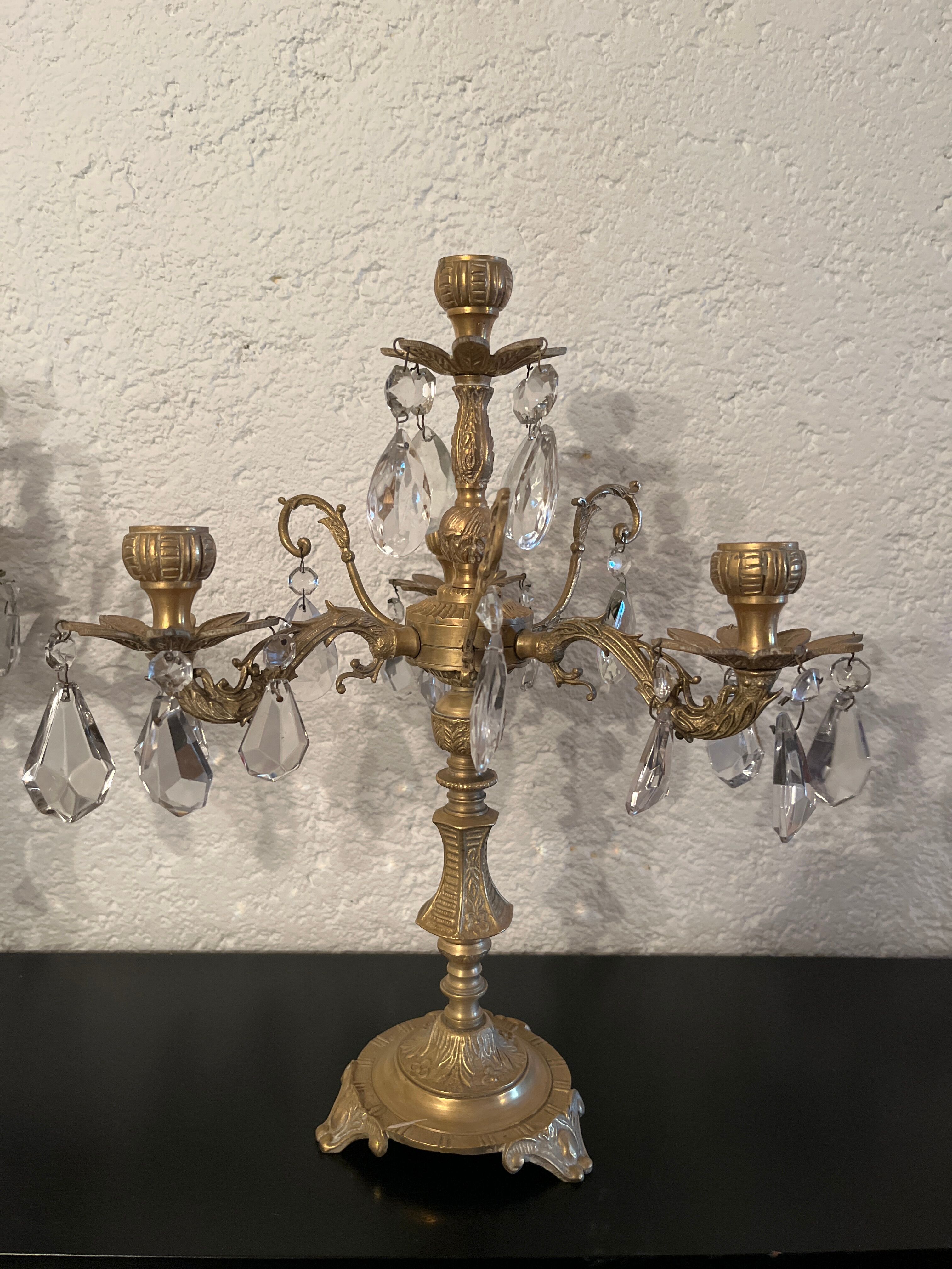 Duo of bronze chandeliers with tassels