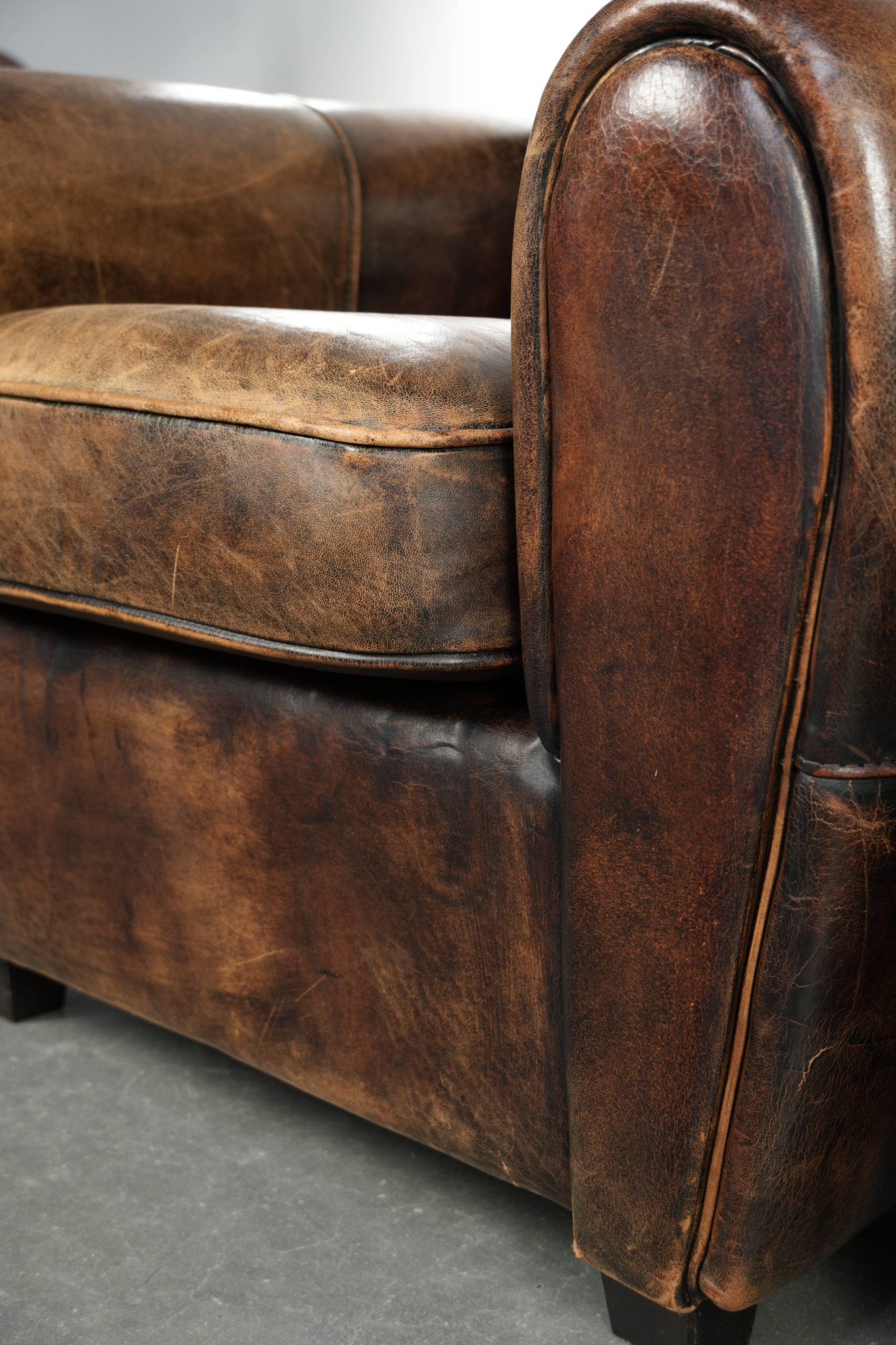 Set of two sheepskin Art Deco design armchairs with beautiful patina