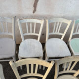 Set of 8 mismatched white bistro chairs