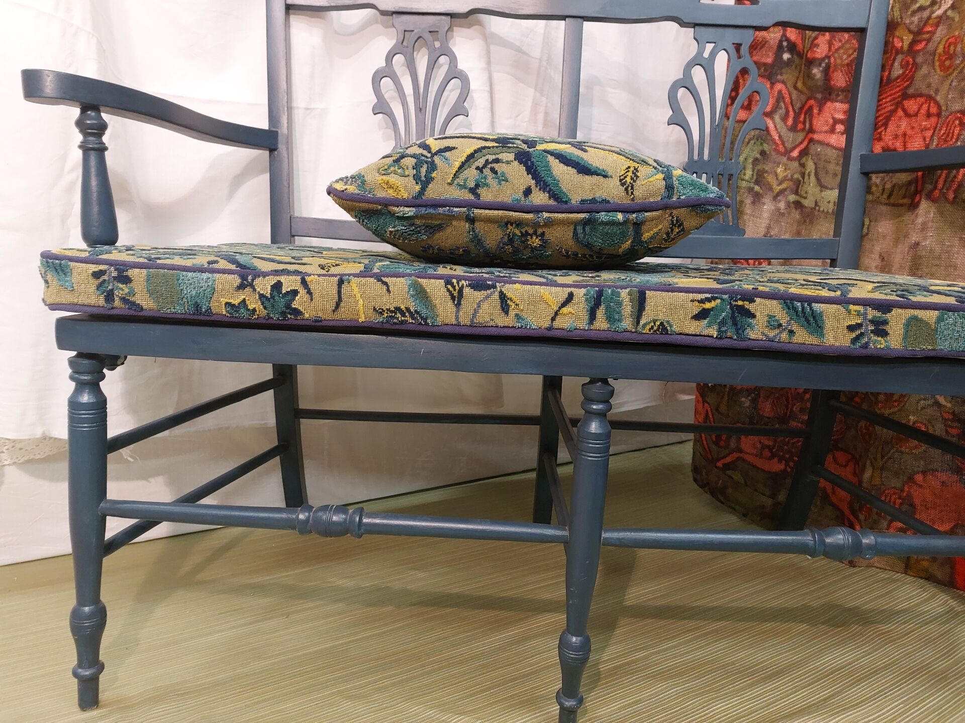 Pretty painted and upholstered bench in green and blue.
