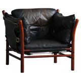 "Lounge chair 'Ilona' by Arne Norell in stained beech and leather, mid-20th century."