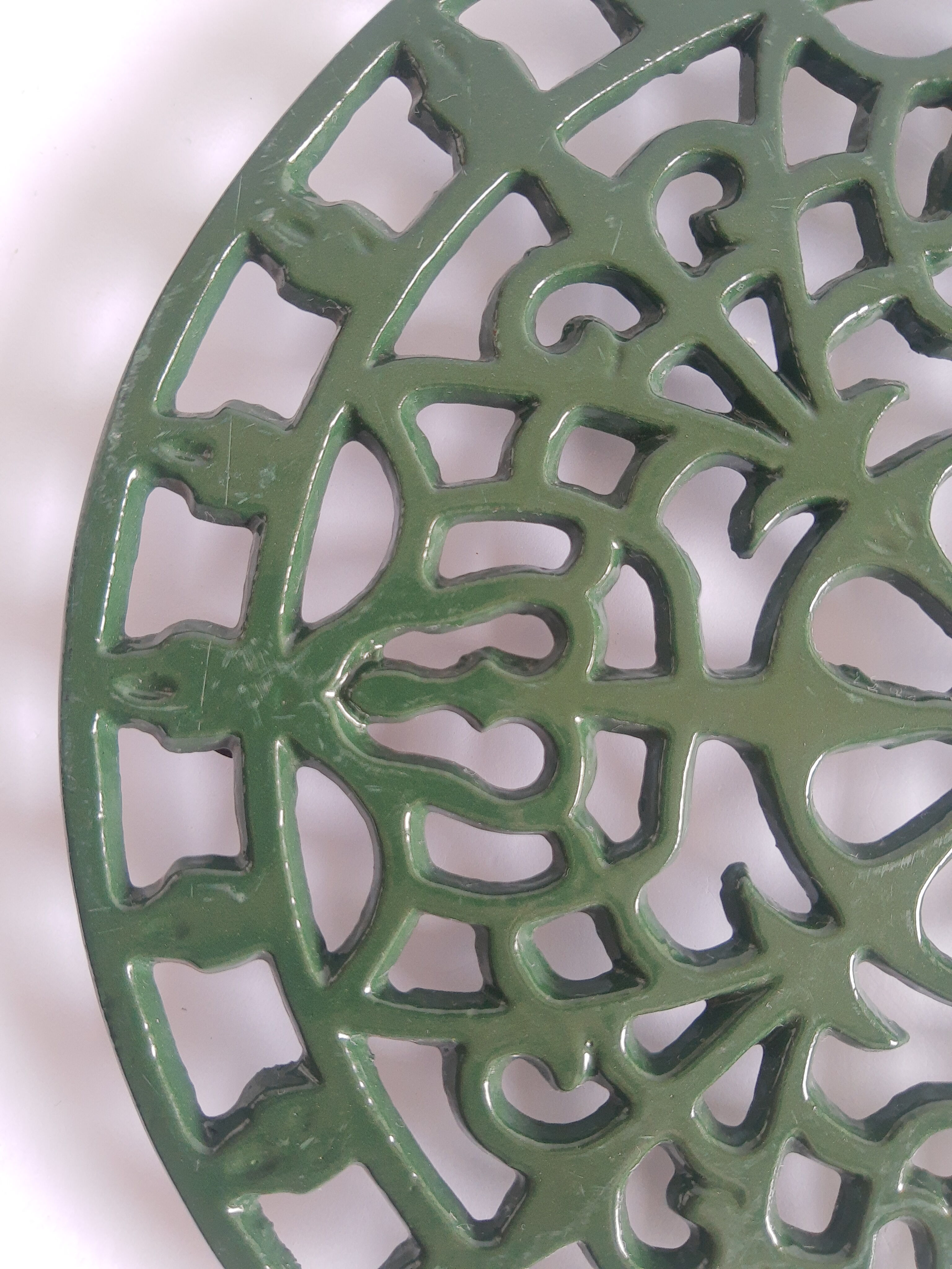 Vintage green cast iron trivet