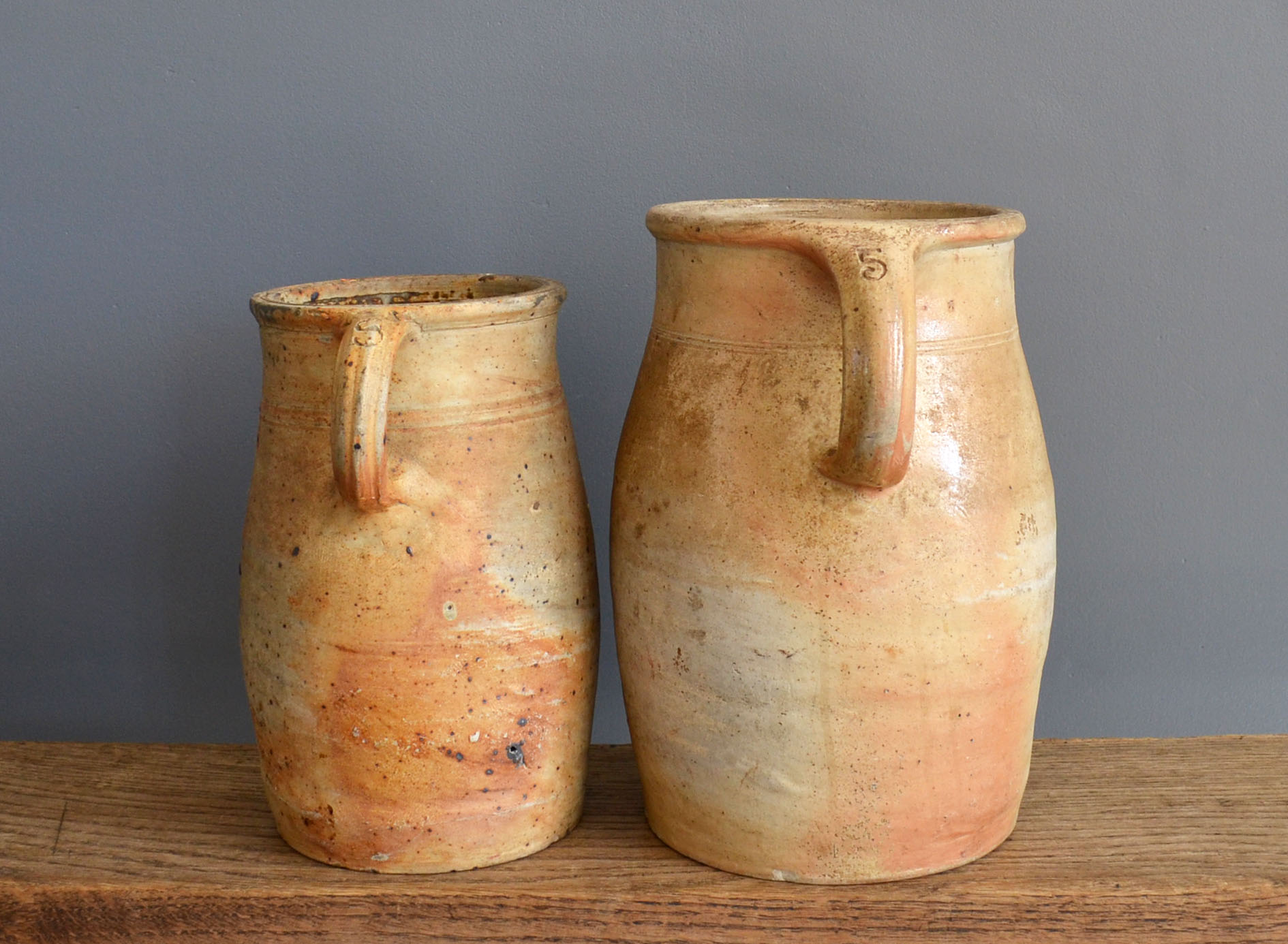 two jugs - old pots in matt sandstone