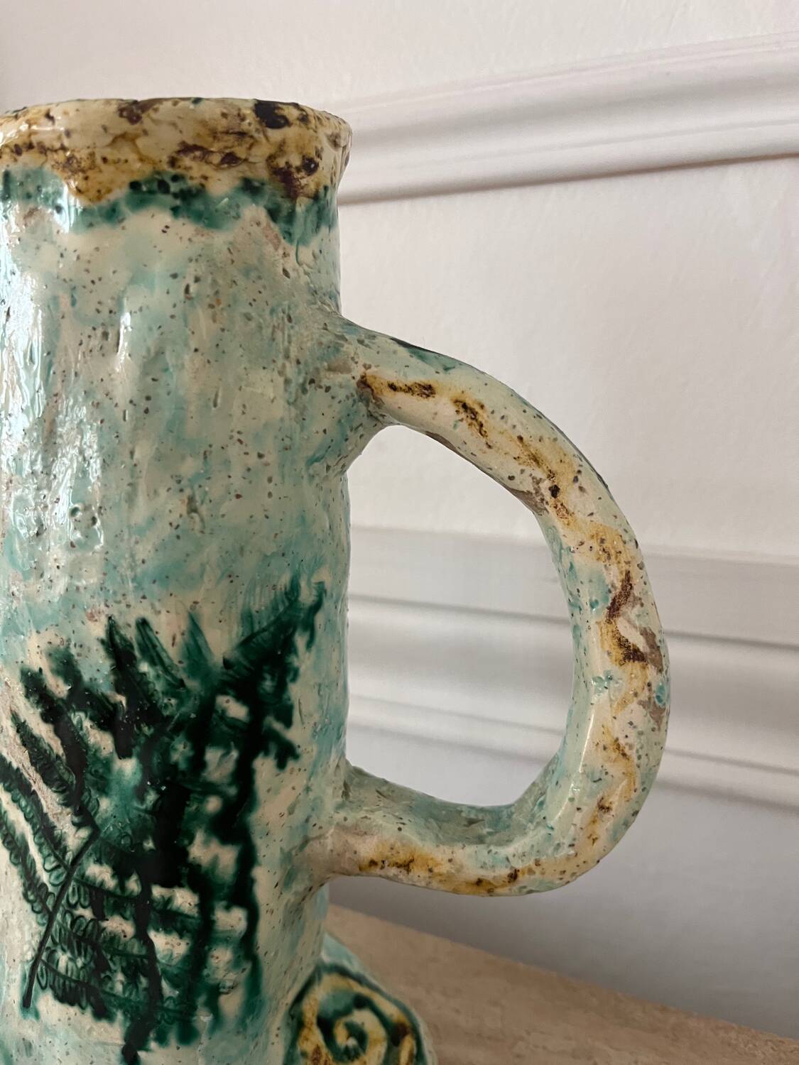 Antique handcrafted ceramic pitcher