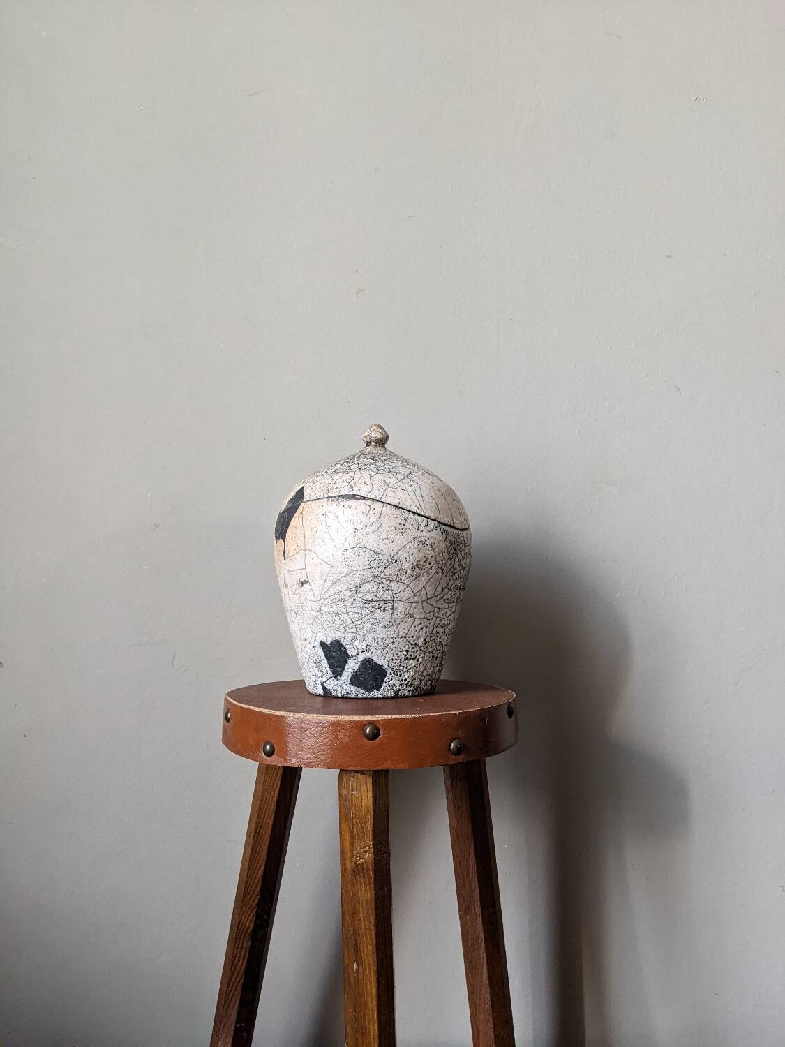 Handmade raku ceramic pot in contemporary Japandi design.