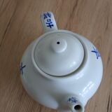 Teapot set and 9 cups with Chinese and French words
