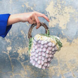 Old bunch pitcher of dabbling grapes