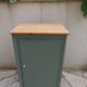 Vintage jam jar enhanced in smoky green, wooden tray.