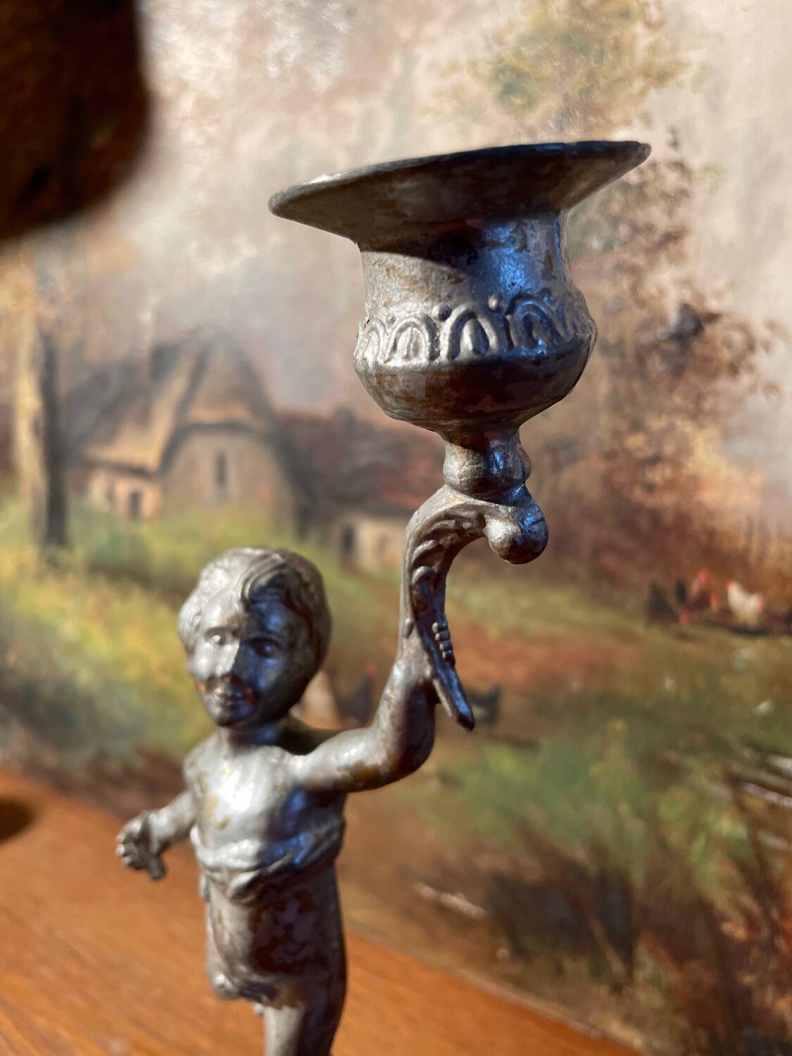 Old cherub candle holder