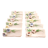 Set of 12 knife holders or porcelain table name holders