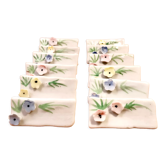 Ensemble de 12 porte-couteaux ou porte nom de table en porcelaine