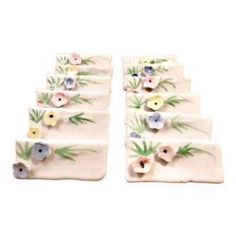 Set of 12 knife holders or porcelain table name holders