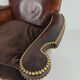Antique leather club chair with stud detailing