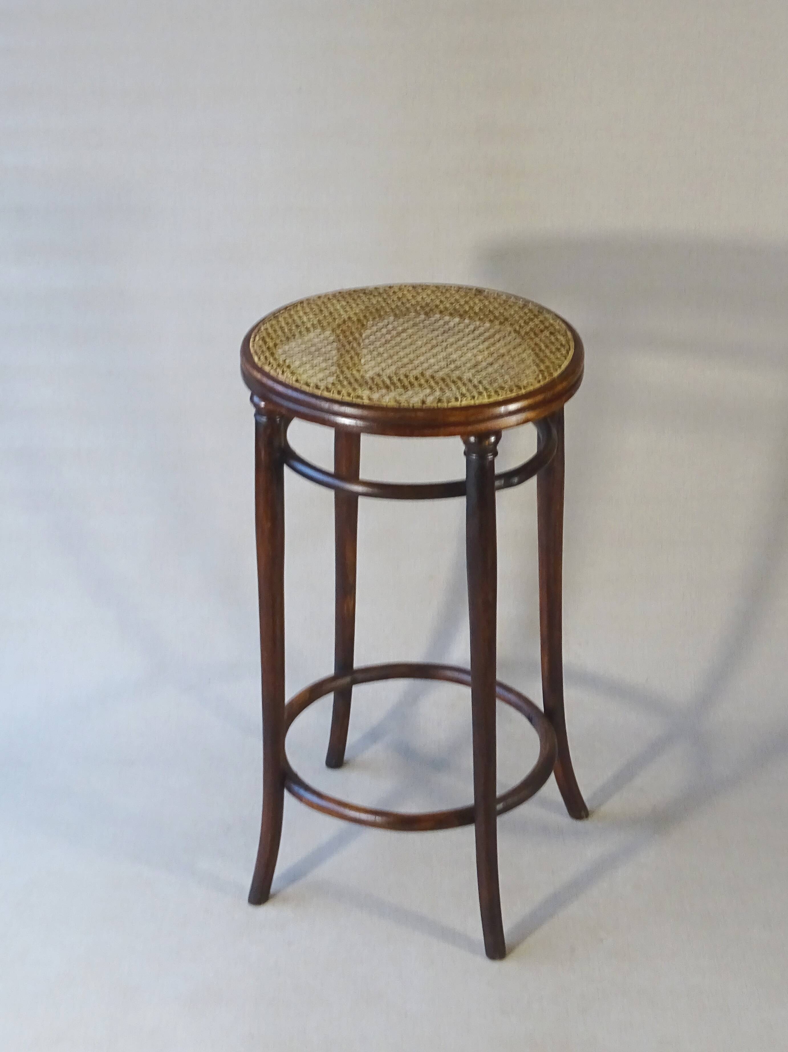 Stool: Bentwood, by Fischel around 1900, caned.