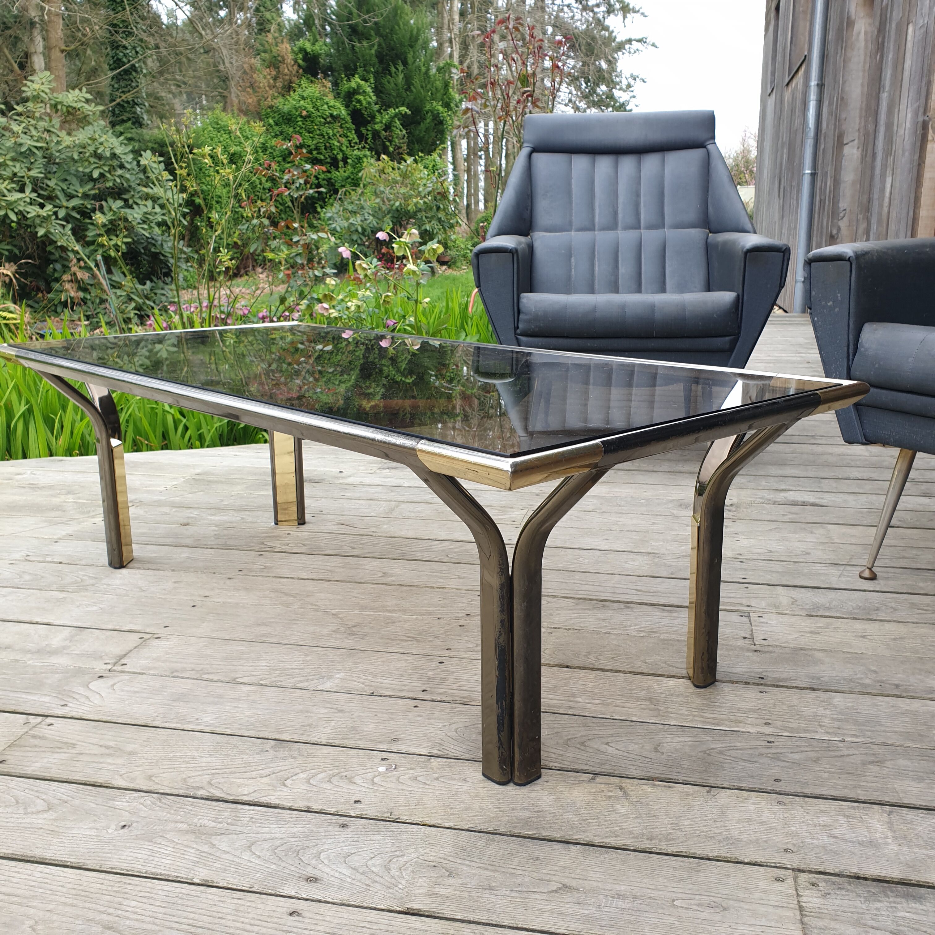 Vintage golden 70s coffee table and space age smoked glass